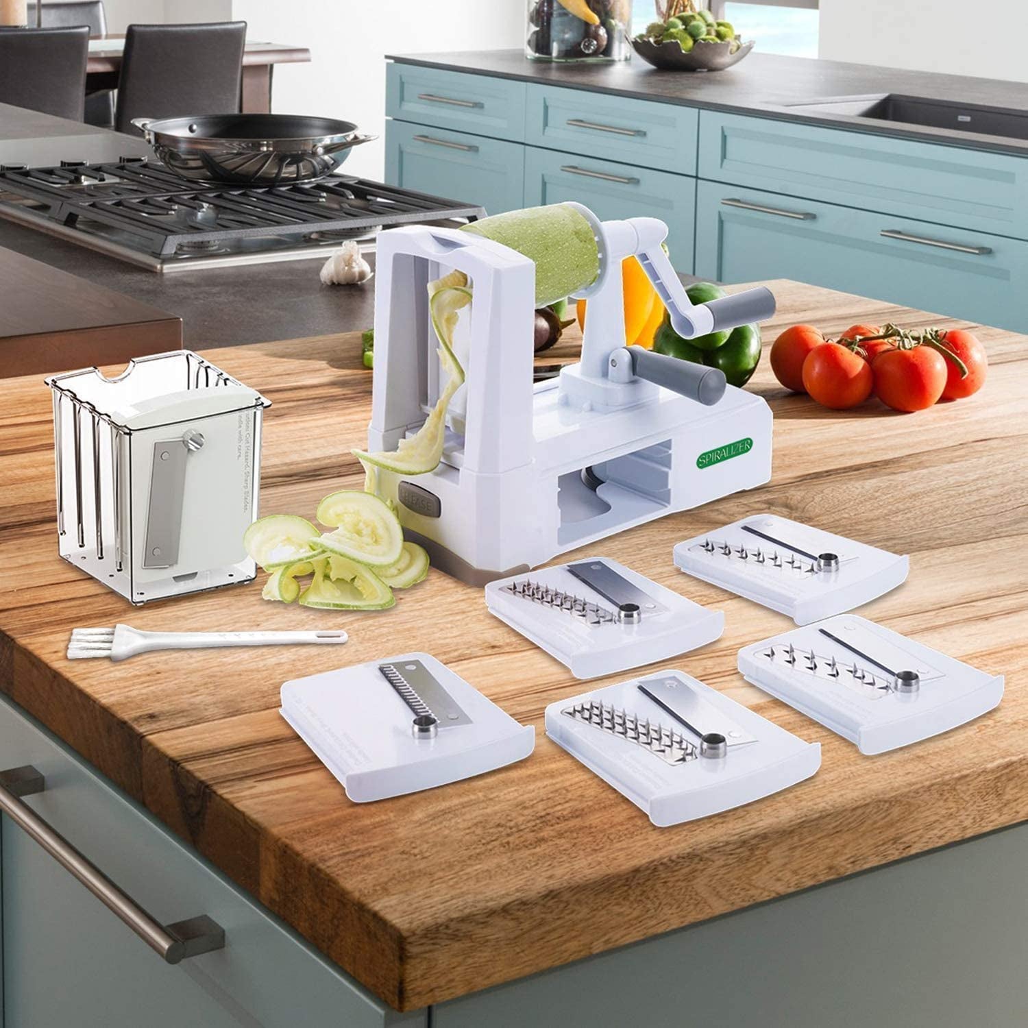 a product shot of the spiralizer and seven blades it comes with