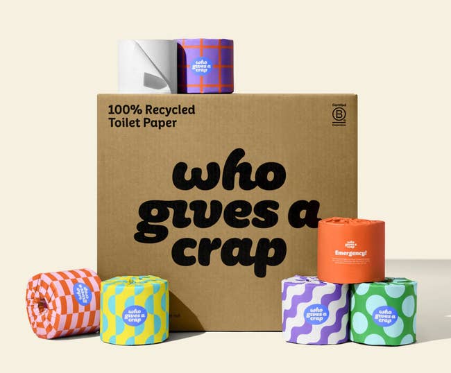 a chipping box with rolls of the toilet paper around it 