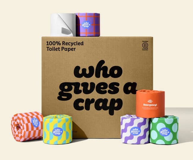 a chipping box with rolls of the toilet paper around it 
