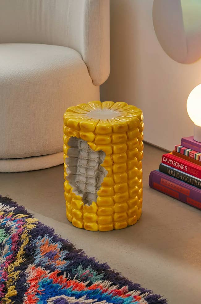 stool that looks like a cob of corn on its end with a bite taken out of it