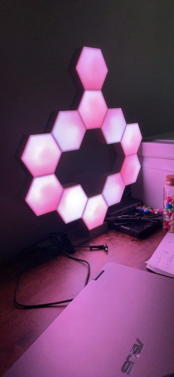 reviewer showing the lights in pink on their desk