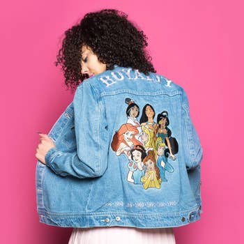  a denim jacket with disney princesses from the '90s on the back