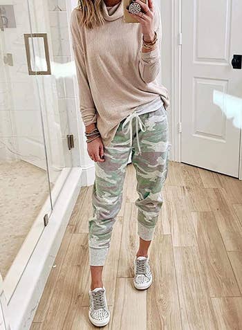 model wearing the pants in camo print