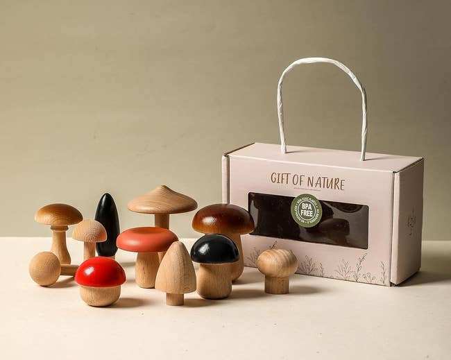 A buying representation showing a acceptable of woody mushroom toys successful assorted shapes and sizes, adjacent to a boxed bundle labeled