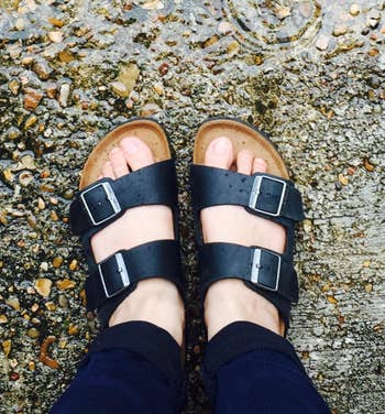 different reviewer wearing the same sandals in black