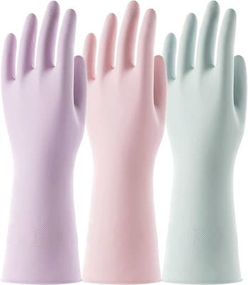 a trio of pastel colored rubber gloves