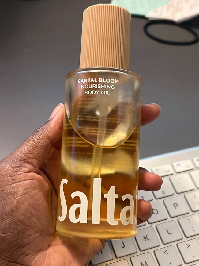 reviewer holding saltair assemblage oil