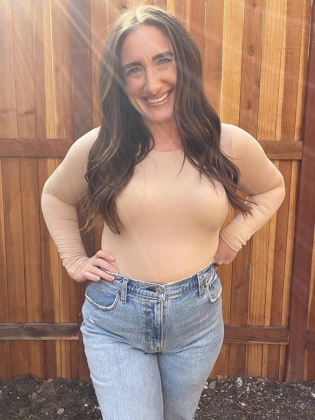A reviewer successful the beige bodysuit