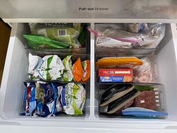 reviewer photo of clear plastic bins organizing freezer drawer