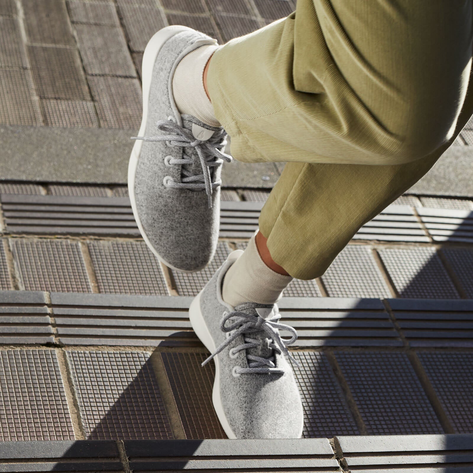 model wearing gray wool sneakers
