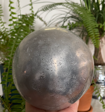 a solid ball made from hammered aluminum foil