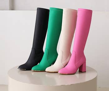 four knee-high boots each in a different color 
