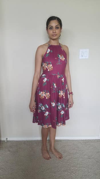 Reviewer wearing floral dress