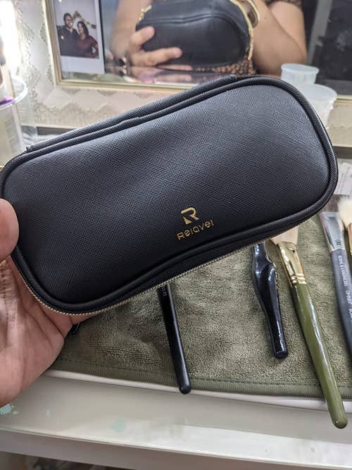reviewer photo of black travel makeup bag