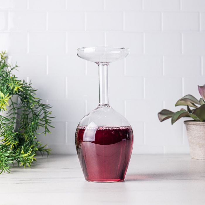 A stemmed wine glass that looks like it's upside down that you drink out of the base of