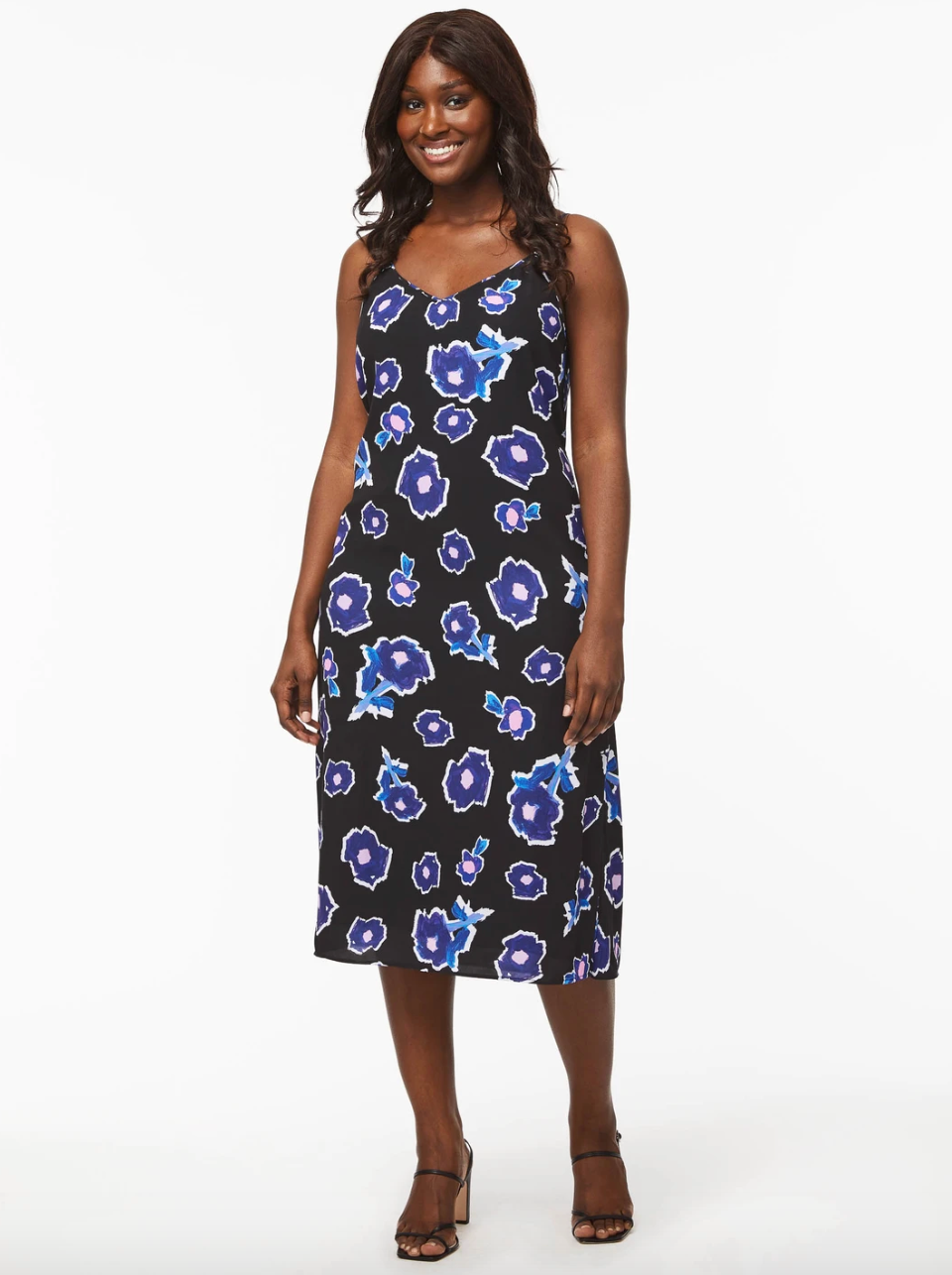model wearing black dress with blue florals
