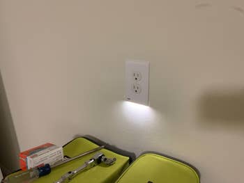 reviewer photo of the outlet with the night-light on