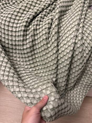 Reviewer showing waffle cloth of the cooling broad successful a sage greenish color