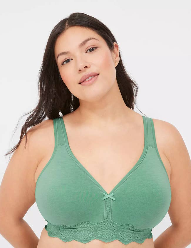 Model in a green bralette with lace detailing