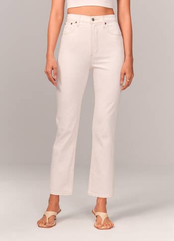 A close up of the white jeans in straight sizes