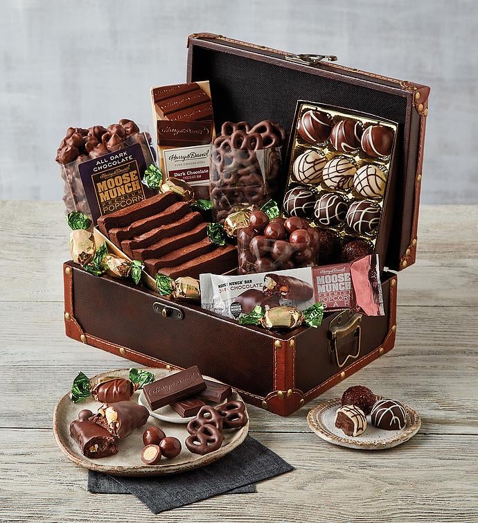 a chest of a bunch of different types of chocolates (truffles, pretzels, moose munch, etc)