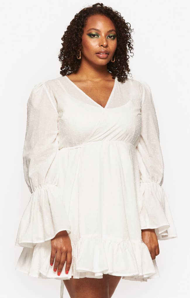 model wearing ruffled white dress