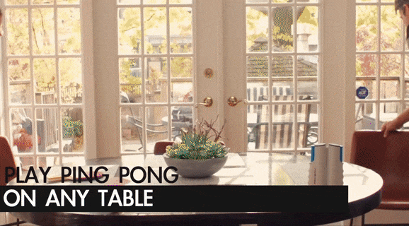 gif of family of three setting up the table and playing in dining room
