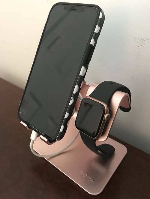 reviewer photo of rose gold stand charging iphone and apple watch