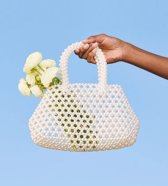 white open weave small bag with handles