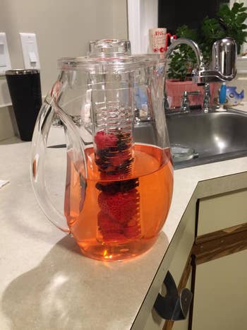reviewer photo of their pitcher with berries in the inner infusion chamber