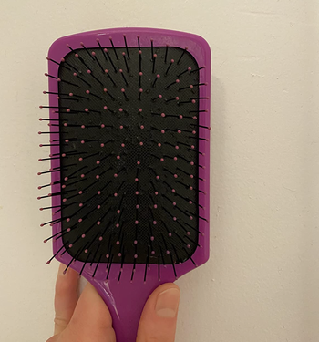 reviewer after photo showing hair brush now clean