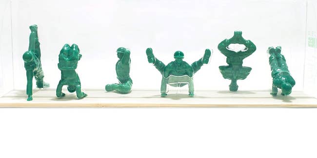 army men toys in yoga poses