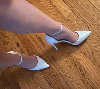 Image of reviewer wearing the white heels