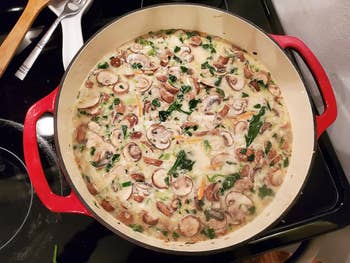 a soup cooked inside the red dutch oven