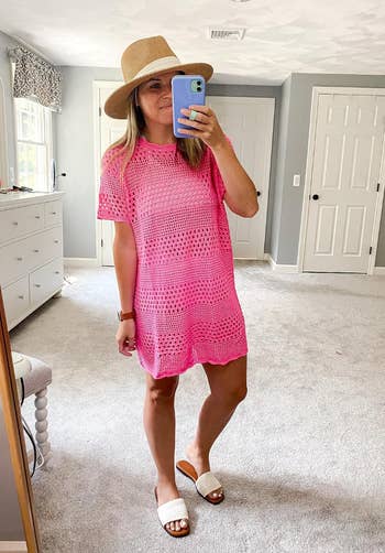 reviewer in a pink crochet short sleeved cover up  dress 