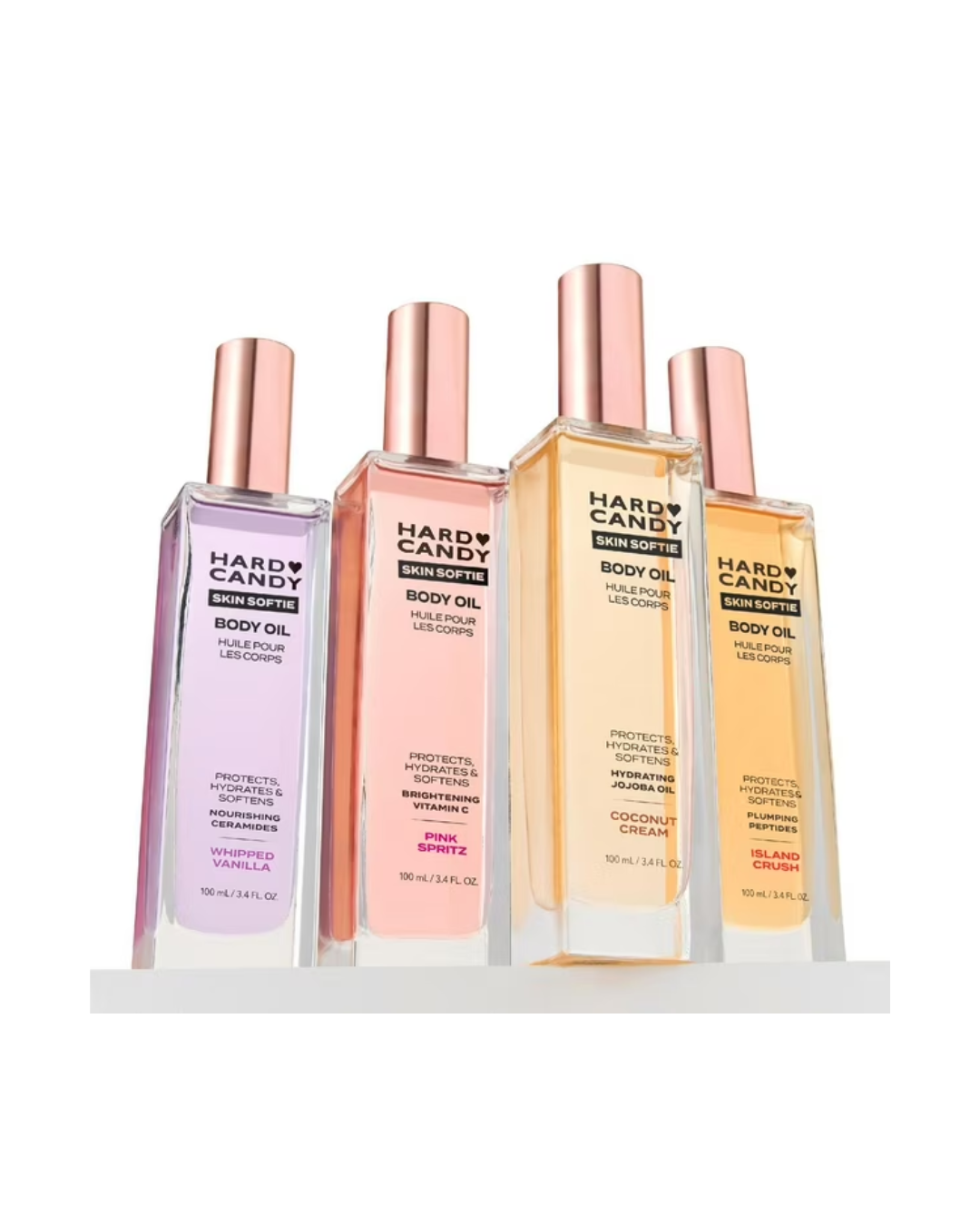 4 different glasses bottles of body oil, all different colours