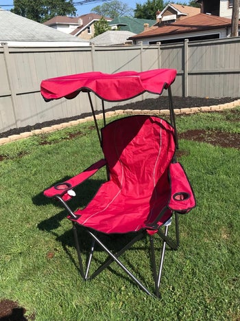 reviewer photo of hot pink camping chair with canopy