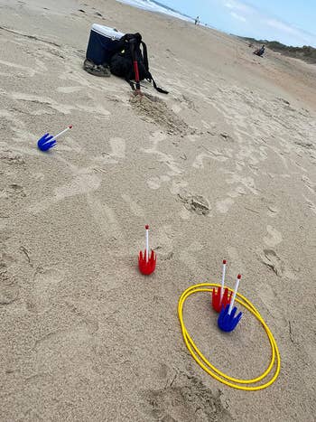 a reviewer's photo of the lawn toss came being played on the beach