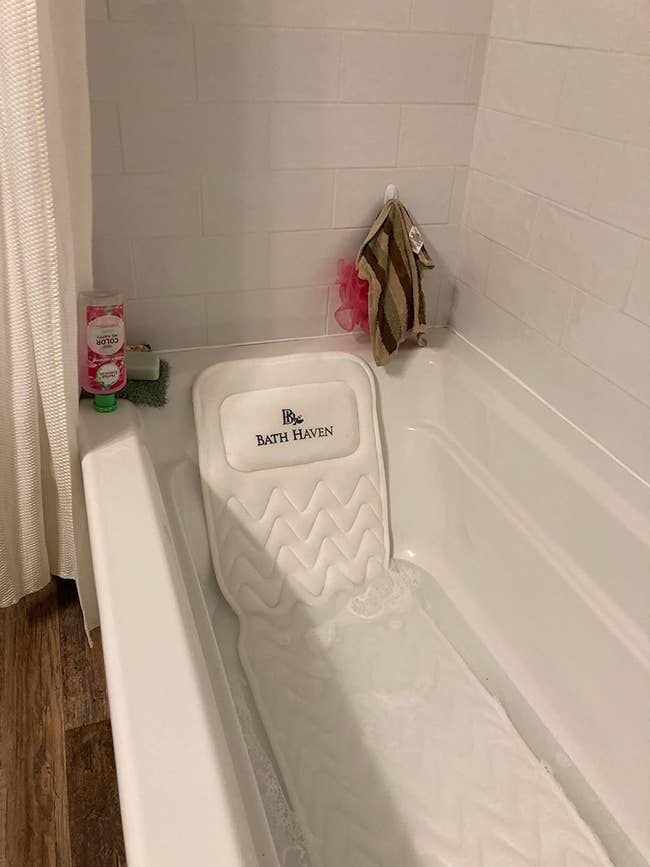 reviewer photo of the bath mat in a tub