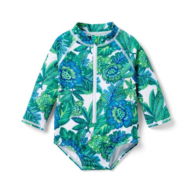 a long sleeve one piece green and blue floral print rash guard