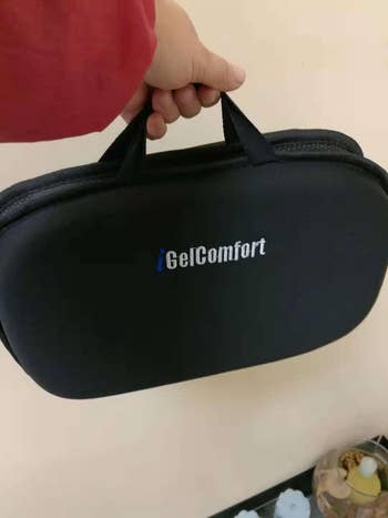 Reviewer holding folded seat cushion