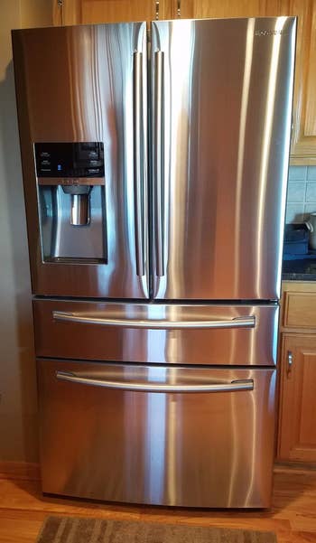 a sparkly clean stainless steel fridge that's been cleaned with the cleaner