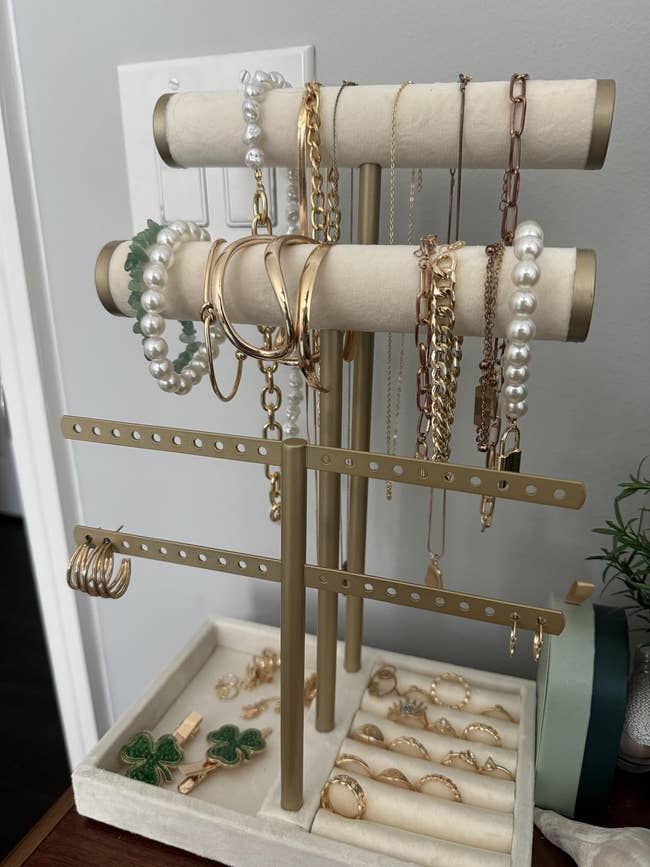 Jewelry basal displaying assorted necklaces, bracelets, and rings