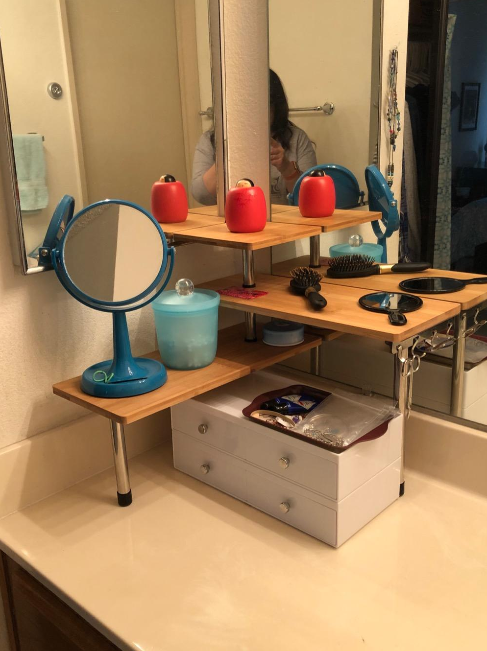 reviewer's corner shelves in the bathroom holding products