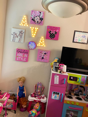 Reviewer's photo showing the marquee letter lights spelling out their child's name on the wall