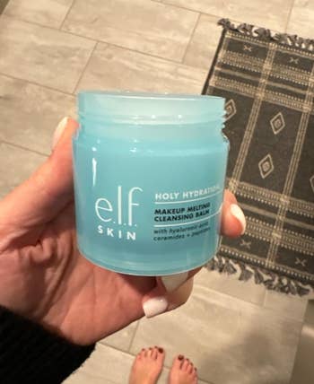 Person holding a jar of e.l.f. Holy Hydration Makeup Melting Cleaning Balm