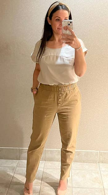 a reviewer wearing the pants in khaki 