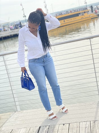 reviewer wearing the heels in white
