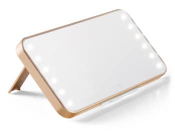 front view of smartphone lit mirror with leg stand