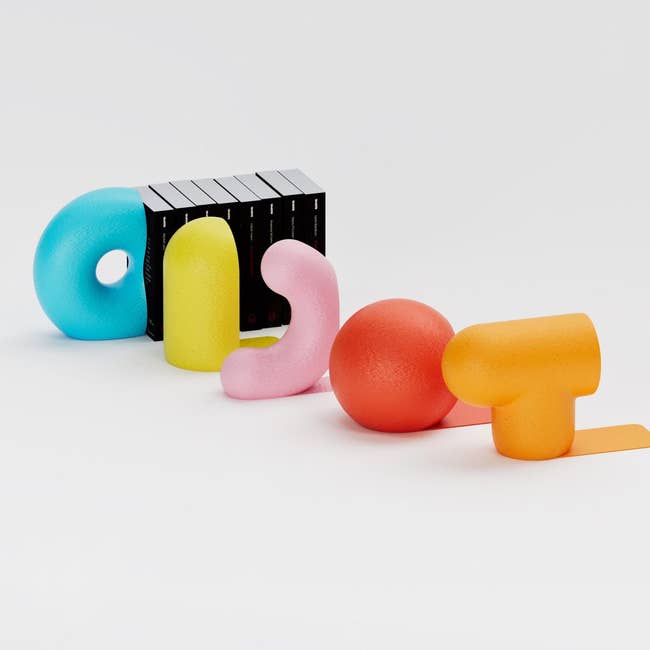 Sculptural bookends successful varied abstract shapes arranged successful a playful sequence, designed to clasp up a enactment of books